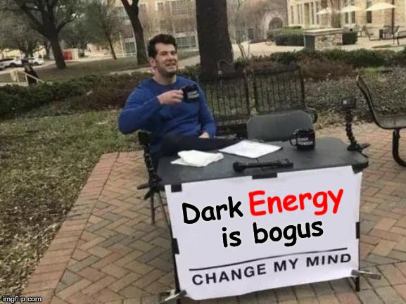 Charlie's table sign says "Dark Energy is bogus"